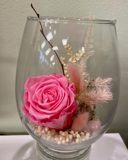 Preserved rose in an egg vessel. "Beach Barbie."