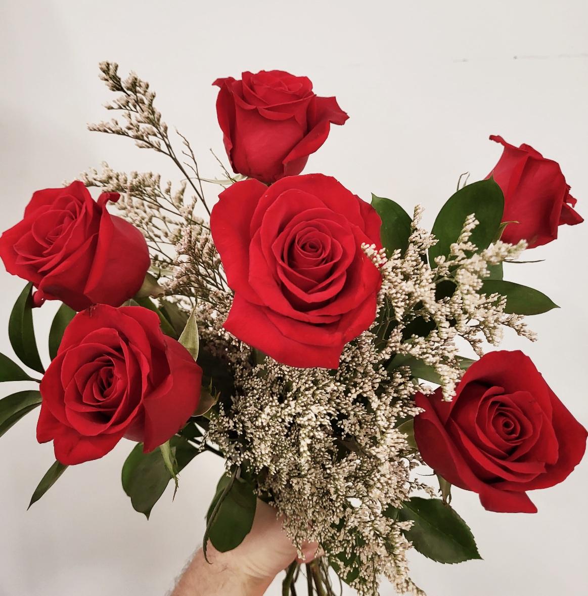 A dozen beautiful red roses hand-tied